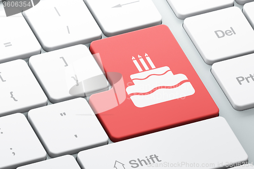 Image of Holiday concept: Cake on computer keyboard background