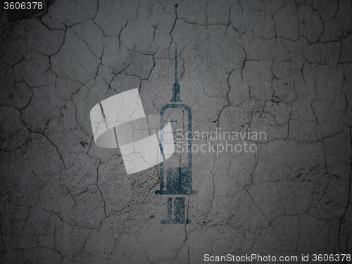 Image of Health concept: Syringe on grunge wall background