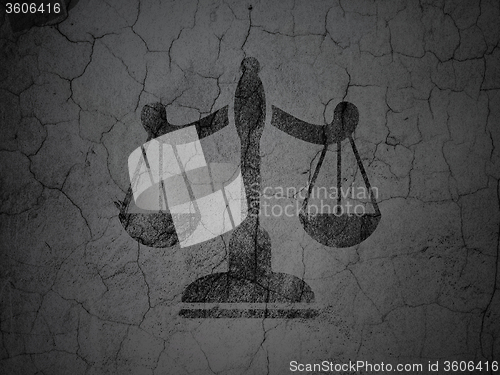 Image of Law concept: Scales on grunge wall background