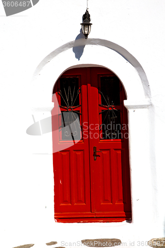 Image of white  red brown  door in antique 