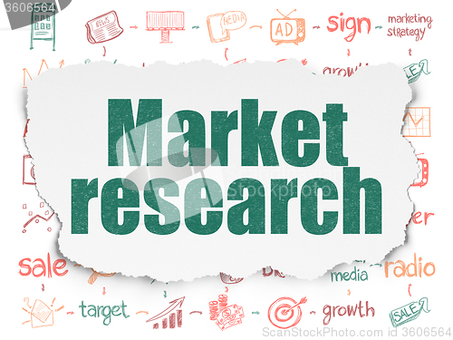 Image of Advertising concept: Market Research on Torn Paper background