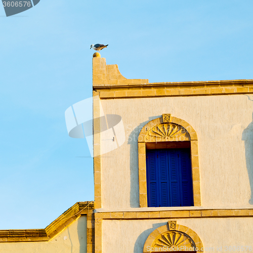 Image of   yellow window in morocco africa old construction and brown wal