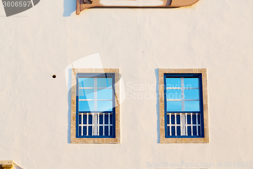 Image of blue window in morocco africa  and  wall  construction