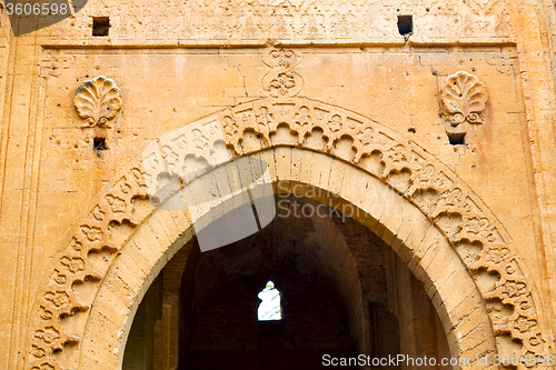 Image of old door in morocco   wall ornate   yellow