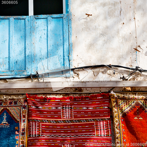 Image of blue window in morocco africa old construction and brown wall re