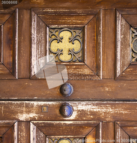 Image of   knocker and wood  glass door caronno varesino varese italy