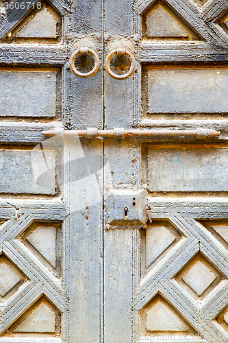 Image of rusty     morocco in africa  and safe padlock 