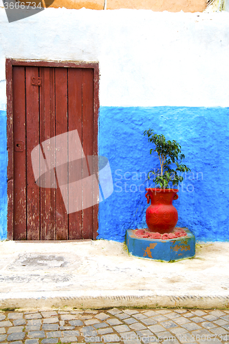 Image of historical blue  in  antique building      style africa  vase po