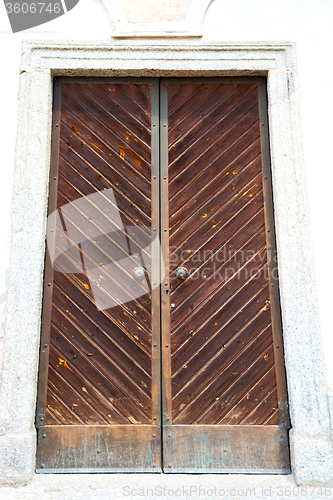 Image of wall door in italy   and wood the historical gate