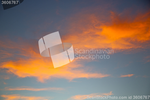 Image of the sunrise in  colored sky white soft clouds  