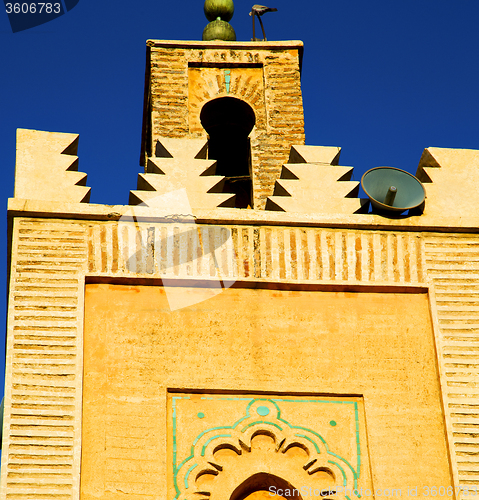 Image of history in maroc africa  minaret religion and the blue     sky