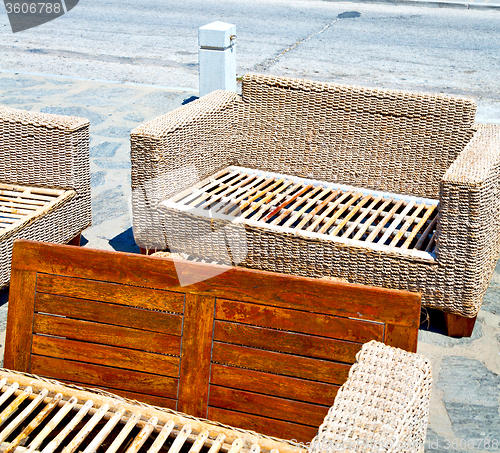 Image of wicker sofa  in santorini europe greece old restaurant chair and