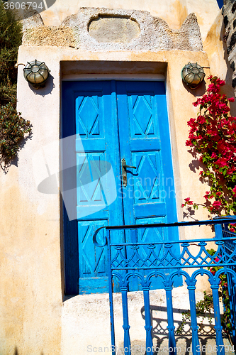 Image of blue door in antique  greece europe and    white 