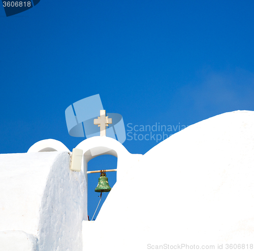 Image of cross  in santorini greece old construction and the sky