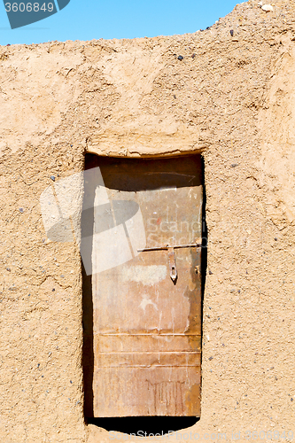 Image of  door in morocco  ancien and wall ornate brown