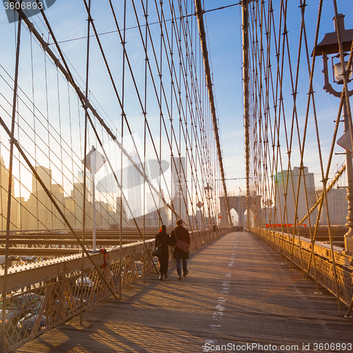 Image of Brooklyn bridge at sunset, New York City.