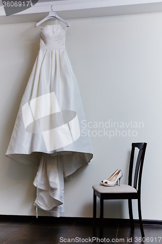 Image of white shoes and wedding dress