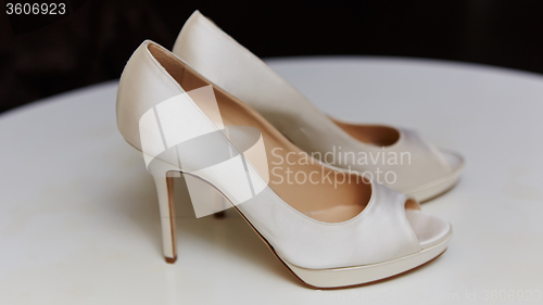 Image of White wedding shoes for women.