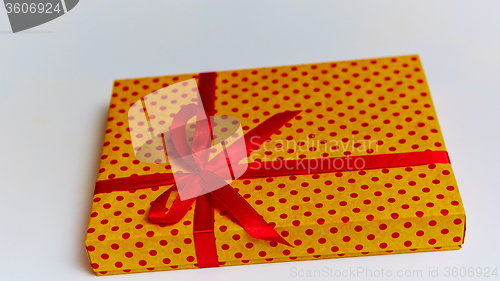 Image of Gift box with ribbon on white background