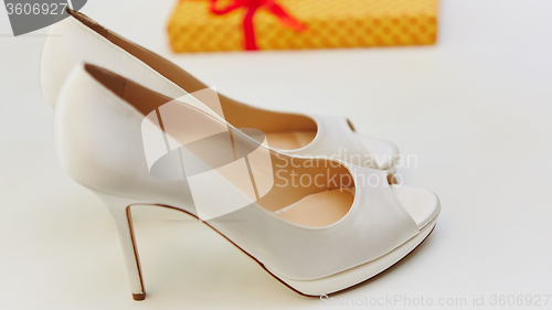 Image of White wedding shoes for women.