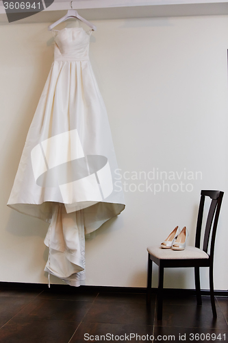 Image of white shoes and wedding dress