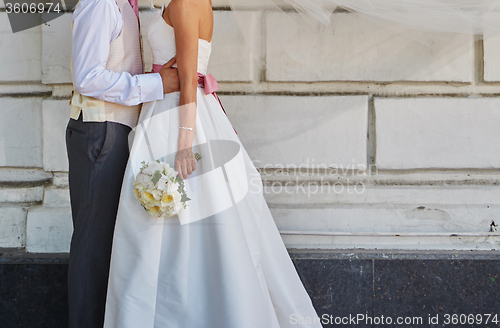 Image of Elegant bride and groom posing together 