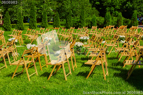 Image of Rows of brown folding chairs