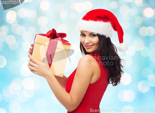 Image of beautiful sexy woman in santa hat with gift box