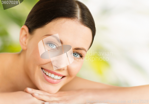 Image of beautiful smiling woman in spa salon