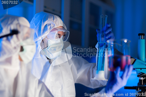 Image of close up of scientists making test in lab