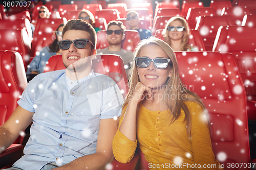 Image of happy couple watching movie in 3d theater