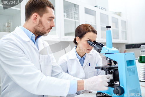 Image of young scientists making test or research in lab