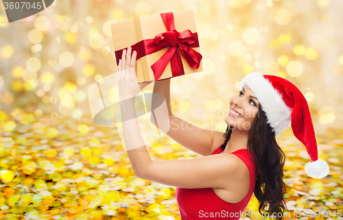 Image of beautiful sexy woman in santa hat with gift box