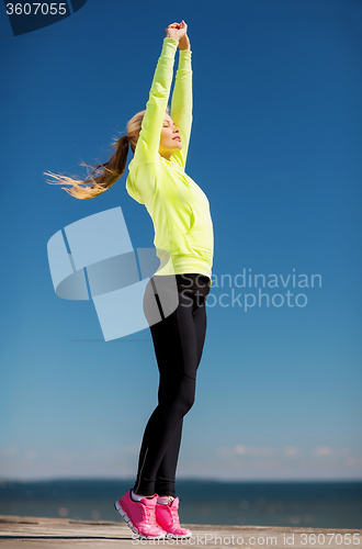 Image of woman doing yoga outdoors