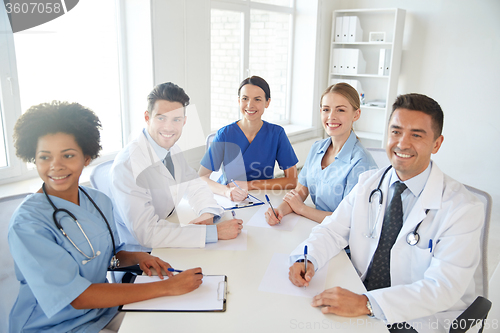 Image of group of happy doctors meeting at hospital office