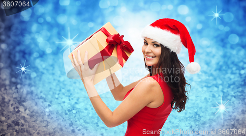 Image of beautiful sexy woman in santa hat with gift box