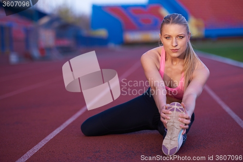 Image of sporty woman on athletic race track