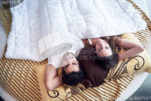 Image of couple relax and have fun in bed