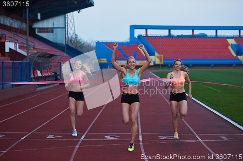 Image of Female Runners Finishing Race Together