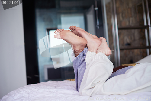 Image of couple relax and have fun in bed