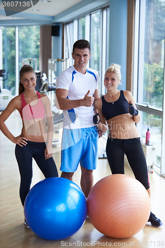 Image of people group in fitness gym