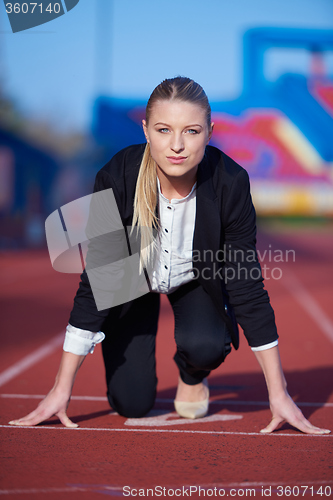 Image of business woman ready to sprint