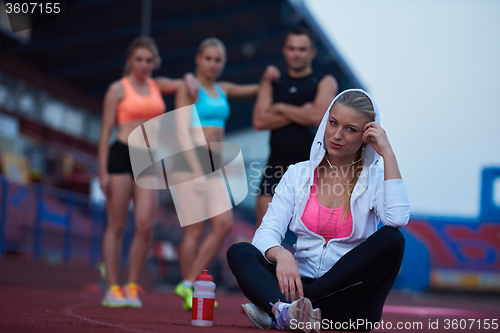 Image of sporty woman on athletic race track
