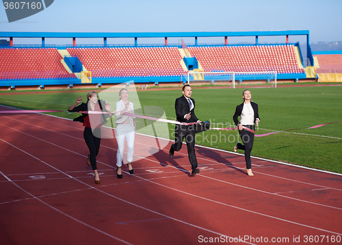 Image of business people running on racing track