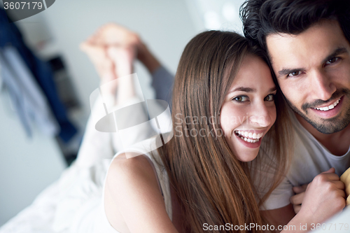 Image of couple relax and have fun in bed