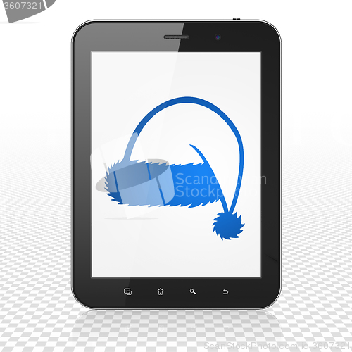 Image of Holiday concept: Tablet Computer with Christmas Hat on display