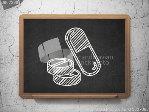 Image of Healthcare concept: Pills on chalkboard background