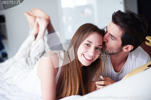 Image of couple relax and have fun in bed