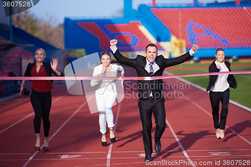 Image of business people running on racing track