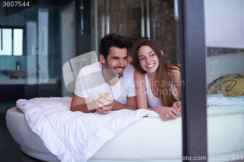 Image of couple relax and have fun in bed